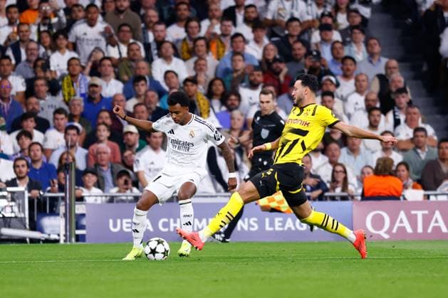 October 22, 2024, Madrid, Madrid, SPAIN: Rodrygo Goes of Real Madrid and Ramy Bensebaini of Borussia Dortmund in action during the UEFA Champions League 2024 25 League Phase MD3 match between Real Madrid CF and Borussia Dortmund at Estadio Santiago Bernabeu on October 22, 2024, in Madrid, Spain. Madrid SPAIN - ZUMAa181 20241022_zaa_a181_188 Copyright: xDennisxAgyemanx