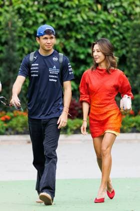 October 3, 2025, Singapore, Singapore: Alexander Albon of Thailand and the Williams Racing Team (L) and his partner Muni He (R) in the paddock ahead of the F1 Grand Prix of Singapore at the Marina Bay Street Circuit. Singapore Singapore - ZUMAs197 20251003_aaa_s197_173 Copyright: xGeorgexHitchensx
