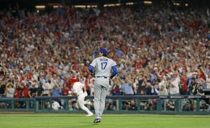 Baseball: Division Series between Dodgers and Phillies Los Angeles Dodgers two-way player Shohei Ohtani (front) is pictured after giving up a two-run triple to J.T. Realmute (back) of the Philadelphia Phillies in the second inning of Game 1 of the Division Series at Citizens Bank Park in Philadelphia on Oct. 4, 2025. A14AA0004911445P