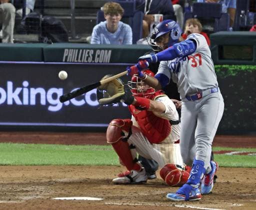 Baseball: Division Series between Dodgers and Phillies Los Angeles Dodgers right fielder Teoscar Hernandez hits a three-run home run in the seventh inning of Game 1 of the National League Division Series against the Philadelphia Phillies at Citizens Bank Park in Philadelphia on Oct. 4, 2025. A14AA0004911892P