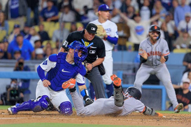 May 14, 2026, Los Angeles, California, USA: Will Smith 16 of the Los Angeles Dodgers is unable to catch the ball for an out at home and allowing Jung Hoo Lee 51 of the San Francisco Giants to score during a regular season MLB, Baseball Herren, USA game on Thursday May 14, 2026 at Dodger Stadium in Los Angeles, California. Dodgers defeat Giants, 5-2. JAVIER ROJAS PI Dodgers Defeat Giants, 5-2 - ZUMAp124 20260514_zaa_p124_015 Copyright: xJavierxRojasx