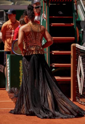 Naomi Osaka of Japan wears a gold sequinned dress under a black sequinned long skirt and corset French Open Tennis, Day Three, Tennis, Roland Garros, Paris, France - 26 May 2026Paris Roland Garros France EDITORIAL USE ONLY No use with unauthorised audio, video, data, fixture lists, club league logos or live services. Online in-match use limited to 120 images, no video emulation. No use in betting, games or single club league player publications. Copyright: xEllaxLing Shutterstockx 16898259r