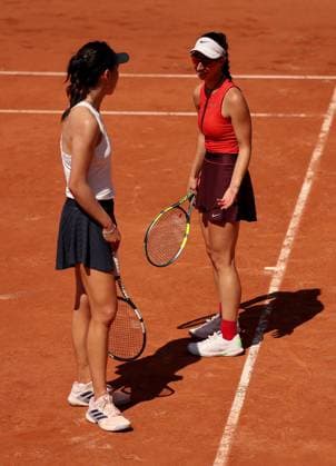 Xinyu Wang of China and Tamara Korpatsch of Germany argue a line call on the same side of the court French Open Tennis, Day Four, Tennis, Roland Garros, Paris, France - 27 May 2026Paris Roland Garros France EDITORIAL USE ONLY No use with unauthorised audio, video, data, fixture lists, club league logos or live services. Online in-match use limited to 120 images, no video emulation. No use in betting, games or single club league player publications. Copyright: xEllaxLing Shutterstockx 16898262do