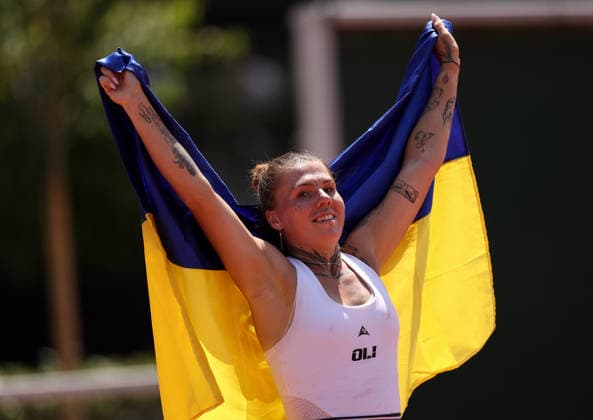 Oleksandra Oliynykova of Ukraine celebrates with the Ukraine flag French Open Tennis, Day Five, Tennis, Roland Garros, Paris, France - 28 May 2026Paris Roland Garros France EDITORIAL USE ONLY No use with unauthorised audio, video, data, fixture lists, club league logos or live services. Online in-match use limited to 120 images, no video emulation. No use in betting, games or single club league player publications. Copyright: xEllaxLing Shutterstockx 16898264h