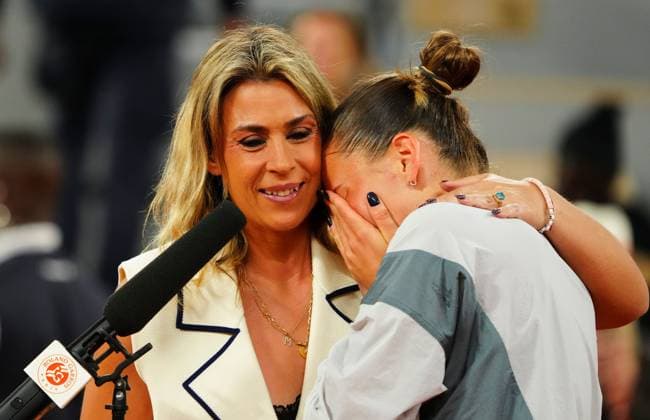 A tearful Marta Kostyuk is consoled by Marion Bartoli in her post match on court interviews French Open Tennis, Day Ten, Tennis, Roland Garros, Paris, France - 02 Jun 2026Paris Roland Garros France EDITORIAL USE ONLY No use with unauthorised audio, video, data, fixture lists, club league logos or live services. Online in-match use limited to 120 images, no video emulation. No use in betting, games or single club league player publications. Copyright: xJavierxGarcia Shutterstockx 16906549g