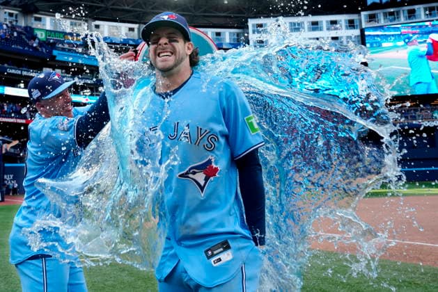 June 6, 2026, Toronto, On, CANADA: Toronto Blue Jays Myles Straw, left, douses teammate Ernie Clement with sports drink following MLB, Baseball Herren, USA baseball action against the Baltimore Orioles, in Toronto, Saturday, June 6, 2026. Canada News - June 6, 2026 - ZUMAc35_ 20260606_zaf_c35_016 Copyright: xFrankxGunnx