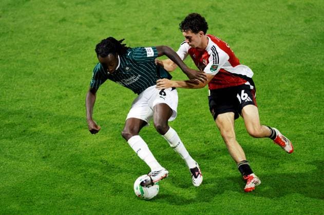 Malachi Boateng of Plymouth Argyle and Charlie Cummins of Exeter City. Plymouth Argyle v Exeter City, EFL Carabao Cup, First Round, Football, Home Park, Plymouth, UK - 10 Aug 2026Plymouth Home Park United Kingdom EDITORIAL USE ONLY No use with unauthorised audio, video, data, fixture lists, club league logos or live services. Online in-match use limited to 120 images, no video emulation. No use in betting, games or single club league player publications. Copyright: xJamesxMarsh Shutterstockx 17061088bu