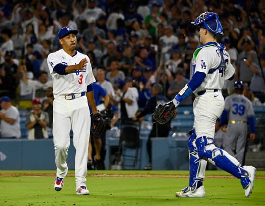 Los Angeles Dodgers closing pitcher Edwin Diaz celebrates with catcher Hunter Feduccia after securing his first save of August , closing out a 6-5 win over the Kansas City Royals after two blown saves in Arizona at Dodger Stadium in Los Angeles on Monday, August 10, 2026. LAP2026081002 JIMxRUYMEN