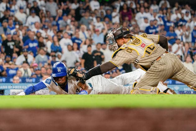 September 24, 2026, Los Angeles, California, USA: Josue De Paula 95 of the Los Angeles Dodgers is tagged out at home plate by San Diego Padres during a regular-season MLB, Baseball Herren, USA game on Thursday September 24, 2026 at Dodger Stadium in Los Angeles, California.Dodgers defeat Padres, 7-0. ENRIQUE GURROLA BNS PI Dodgers Defeat Padres, 7-0 - ZUMAp124 20260924_zaa_p124_034 Copyright: xEnriquexGurrolax