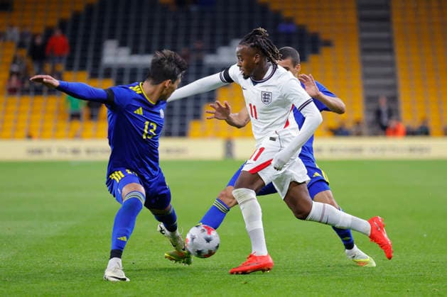 Wolverhampton, England, 25th September 2026. Jamie Gittens of England U21, U 21 and Sagi Malikaidar of Kazakhstan U21 during the England U21 vs Kazakhstan U21 UEFA European Under-21 Championship Qualifier match at Molineux, Wolverhampton. Picture credit should read: James Baylis Sportimage EDITORIAL USE ONLY. No use with unauthorised audio, video, data, fixture lists, club league logos or live services. Online in-match use limited to 120 images, no video emulation. No use in betting, games or single club league player publications. 158_SPI_JB_U21_ENGLAND_KAZAKHSTAN SPI-5018-0158
