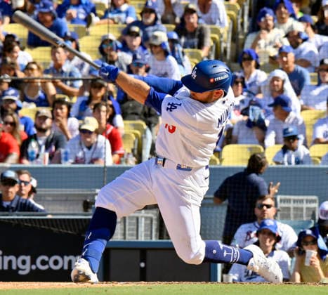 Los Angeles Dodgers Max Muncy hits a solo home run in the sixth inning against the Atlanta Braves in game one of the National League Division Series at Dodger Stadium on Saturday, October 3, 2026 in Los Angeles, California. The Dodgers defeated the Braves 5-3. LAP20261003806 JIMxRUYMEN