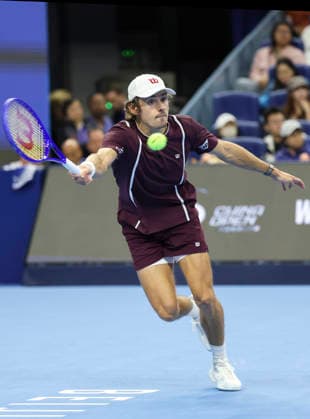 (261006) -- BEIJING, Oct. 6, 2026 -- Alex de Minaur of Australia hits a return during the men s singles final match against Novak Djokovic of Serbia at 2026 China Open tennis tournament in Beijing, China, Oct. 6, 2026. ) (SP)CHINA-BEIJING-TENNIS-CHINA OPEN-MEN S SINGLES-FINAL(CN) BaixXuefei