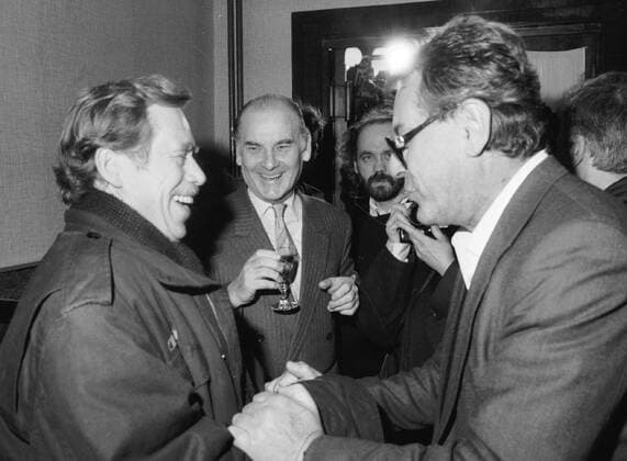 Civic Forum leader Vaclav Havel, left, meets his long-time friend Milos Forman, Czech Oscar-winning film director, at the screening of his film Valmont in Prague on December 15, 1989. Forman, who became a naturalized citizen of the United States in 1977, came to Czechoslovakia to support the Velvet Revolution. Czech Oscar-winning costume designer Theodor Pistek smiles in the middle.Vaclav Havel died on Sunday, Dec. 18, 2011, aged 75. Havel, a dissident playwright jailed by Communists, became Czechoslovak and than Czech president and a symbol of peace and freedom after bringing down communism in Czechoslovakia by leading bloodless Velvet Revolution . CTKPhoto46900473404