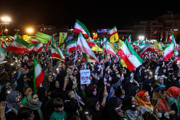 May 12, 2026, Tehran, Iran: Pro-government supporters wave national flags during a state-organized rally, amid a ceasefire in the conflict involving Iran, the United States, and Israel. The United States and Israel launched strikes against Iran on February 28, killing Iranâ€⠢s supreme leader and top military leaders, prompting Iranian authorities to retaliate with strikes on Israel and across the Gulf, while U.S. President Donald Trump recently described the ceasefire agreement with Iran as being in a â€oevery weak†state and the spokesman for the Iranian parliamentâ€⠢s national security commission warned the United States on May 10 against any attacks on vessels in Gulf waters, saying Iranâ€⠢s restraint was over. T - ZUMAi98_ 20260512_zih_i98_014 Copyright: xIranianxSupremexLeader SxOfficex