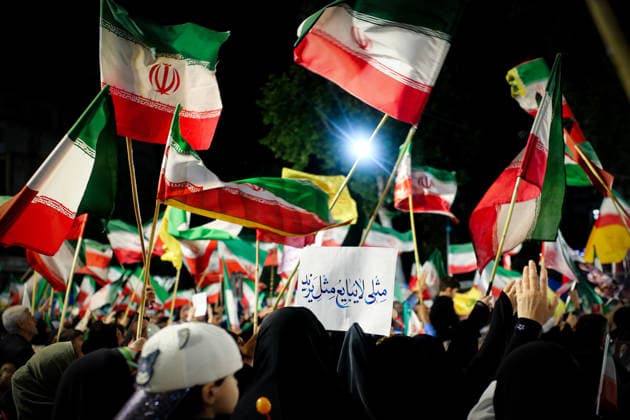 May 12, 2026, Iran, Iran: Pro-government supporters wave national flags during a state-organized rally, amid a ceasefire in the conflict involving Iran, the United States, and Israel. The United States and Israel launched strikes against Iran on February 28, killing Iranâ€⠢s supreme leader and top military leaders, prompting Iranian authorities to retaliate with strikes on Israel and across the Gulf, while U.S. President Donald Trump recently described the ceasefire agreement with Iran as being in a â€oevery weak†state and the spokesman for the Iranian parliamentâ€⠢s national security commission warned the United States on May 10 against any attacks on vessels in Gulf waters, saying Iranâ€⠢s restraint was over. Ira - ZUMAi98_ 20260512_zih_i98_023 Copyright: xIranianxSupremexLeader SxOfficex
