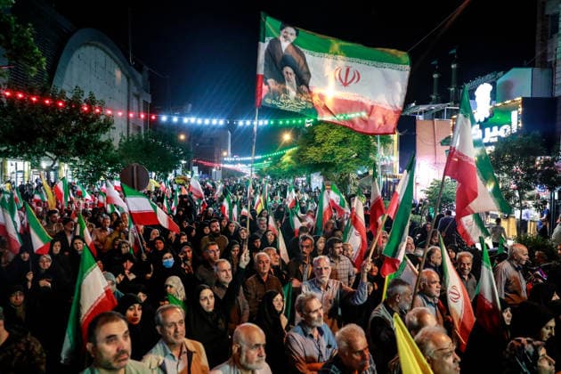 May 12, 2026, Iran, Iran: Pro-government supporters wave national flags during a state-organized rally, amid a ceasefire in the conflict involving Iran, the United States, and Israel. The United States and Israel launched strikes against Iran on February 28, killing Iranâ€⠢s supreme leader and top military leaders, prompting Iranian authorities to retaliate with strikes on Israel and across the Gulf, while U.S. President Donald Trump recently described the ceasefire agreement with Iran as being in a â€oevery weak†state and the spokesman for the Iranian parliamentâ€⠢s national security commission warned the United States on May 10 against any attacks on vessels in Gulf waters, saying Iranâ€⠢s restraint was over. Ira - ZUMAi98_ 20260512_zih_i98_027 Copyright: xIranianxSupremexLeader SxOfficex