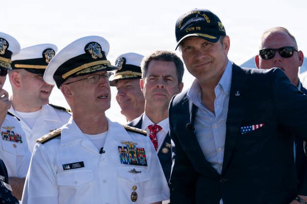 May 18, 2026, Norfolk, Va, United States of America: U.S. Defense Secretary Pete Hegseth, right, stands with Adm. Daryl Caudle, Chief of Naval Operations, left, during the homecoming celebration for the Ford-class super carrier, USS Gerald R. Ford at Naval Station Norfolk, May 16, 2026, in Norfolk, Virginia. The ship returned following a historic 11-month deployment sailing over 57,713 nautical miles. Norfolk United States of America - ZUMAp138 20260518_zaa_p138_045 Copyright: xMc1xClayxM.xWhaley UsxNavyx
