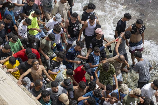 Spain says over 48,300 migrants have returned to Morocco from Ceuta CEUTA, SPAIN - JULY 31: Undocumented migrants, mostly young men, who entered Spain s North African enclave of Ceuta illegally, begin returning to Morocco after realizing their chances of obtaining legal status in Spain are unlikely on July 31, 2026. Meanwhile, small groups of migrants continue trying to cross into Ceuta by swimming or climbing the breakwater surrounding the Fnideq coast. More than 48,300 of the approximately 50,000 migrants who entered the Spanish enclave of Ceuta since early Thursday have returned to Morocco by Friday afternoon, Spain s Interior Ministry said, according to EFE news agency. Abu Adem Muhammed Anadolu Ceuta Spain. Editorial use only. Please Copyright: x2026xAnadoluxAbuxAdemxMuhammedx