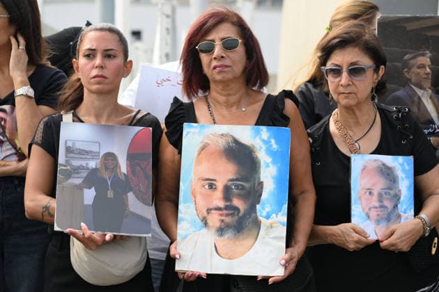 Memorial ceremony held in Lebanon to mark sixth anniversary of Beirut Port explosion BEIRUT, LEBANON - AUGUST 4: People attend a memorial ceremony held in front of the monument bearing the names of those killed in the Aug. 4, 2020 Beirut Port explosion, marking the sixth anniversary of the disaster while holding photos, in Beirut, Lebanon, on August 4, 2026. The ceremony was attended by families of the victims, Lebanese Justice Minister Adel Nassar, Information Minister Paul Markus, Social Affairs Minister Haneen El Sayed, ambassadors of several countries that lost citizens in the explosion, and other members of the diplomatic corps. Houssam Shbaro Anadolu Beirut Lebanon. Editorial use only. Please get in touch for any other usage. Copyright: x2026xAnadoluxHoussamxShbarox