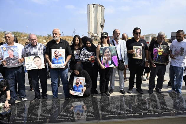 Memorial ceremony held in Lebanon to mark sixth anniversary of Beirut Port explosion BEIRUT, LEBANON - AUGUST 4: People attend a memorial ceremony held in front of the monument bearing the names of those killed in the Aug. 4, 2020 Beirut Port explosion, marking the sixth anniversary of the disaster while holding photos, in Beirut, Lebanon, on August 4, 2026. The ceremony was attended by families of the victims, Lebanese Justice Minister Adel Nassar, Information Minister Paul Markus, Social Affairs Minister Haneen El Sayed, ambassadors of several countries that lost citizens in the explosion, and other members of the diplomatic corps. Houssam Shbaro Anadolu Beirut Lebanon. Editorial use only. Please get in touch for any other usage. Copyright: x2026xAnadoluxHoussamxShbarox