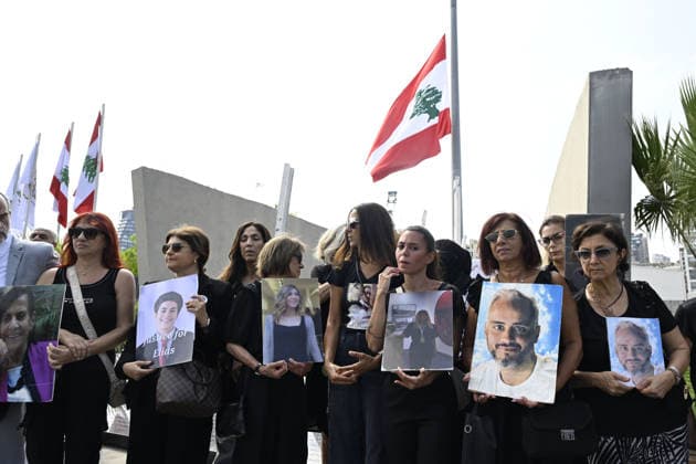 Memorial ceremony held in Lebanon to mark sixth anniversary of Beirut Port explosion BEIRUT, LEBANON - AUGUST 4: People attend a memorial ceremony held in front of the monument bearing the names of those killed in the Aug. 4, 2020 Beirut Port explosion, marking the sixth anniversary of the disaster while holding photos, in Beirut, Lebanon, on August 4, 2026. The ceremony was attended by families of the victims, Lebanese Justice Minister Adel Nassar, Information Minister Paul Markus, Social Affairs Minister Haneen El Sayed, ambassadors of several countries that lost citizens in the explosion, and other members of the diplomatic corps. Houssam Shbaro Anadolu Beirut Lebanon. Editorial use only. Please get in touch for any other usage. Copyright: x2026xAnadoluxHoussamxShbarox