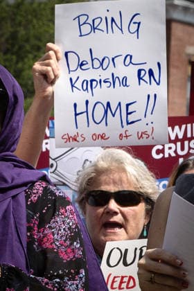 August 5, 2026, Portland, Maine, USA: Members of the Maine State Nurses Association union protest federal Immigration and Customs Enforcement (ICE) on the lawn outside Maine Medical Center, the stateâ€⠢s largest hospital, on Wednesday morning, August 5, 2026. Nurses demanded the release of colleague and medical-surgical nurse, DEBORA KAPISHA, who was detained by federal officials at Logan Airport in Boston on July 30, 2026. Union members said KAPISHA, originally from Zambia, has federal authorization to work in Maine while awaiting the outcome of her asylum case. In addition to KAPISHAâ€⠢S release, union members demanded their employer, Maine Medical Center, take immediate steps to formally sponsor KAPISHA for permanent residency. - ZUMAb349 20260805_znp_b349_008 Copyright: xTroyxR.xBennettx