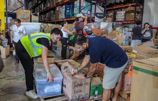 August 11, 2026, Fl, USA: Volunteers filled boxes with supplies of aid for the victims in Colombia, as a press conference held by Michael Capponi, founder of the Global Empowerment Mission (GEM), was taking place to detail the urgent relief operations and a call for local volunteers and the need of donations a day after the devastating 7.4-magnitude earthquake that struck western Colombia on Aug. 10, at the organizationâ€⠢s headquarters in Doral, Florida, on Tuesday, Aug. 11, 2026. USA - ZUMAm67_ 20260811_zaf_m67_002 Copyright: xPedroxPortalx