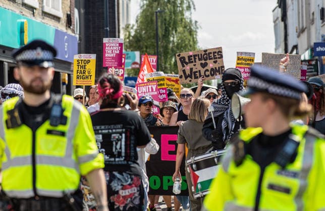 Anti-immigration demonstrators and Stand Up to Racism counter-protesters rally in Maidstone MAIDSTONE, UNITED KINGDOM - AUGUST 15: Activists from Stand Up to Racism assemble outside County Hall in Maidstone, Kent, United Kingdom, on August 15, 2026, to counter-protest against the far-right Kent Nationalist Movement as they gathered before marching through the town center. While the far-right group voiced opposition to government border policies, asylum seeker housing programs, and mass migration, Stand Up to Racism demonstrators chanted slogans and displayed placards to denounce far-right activity and express solidarity with refugees, with police officers maintaining a presence to keep the opposing groups separated. Stuart Brock Anadolu M Copyright: x2026xAnadoluxStuartxBrockx