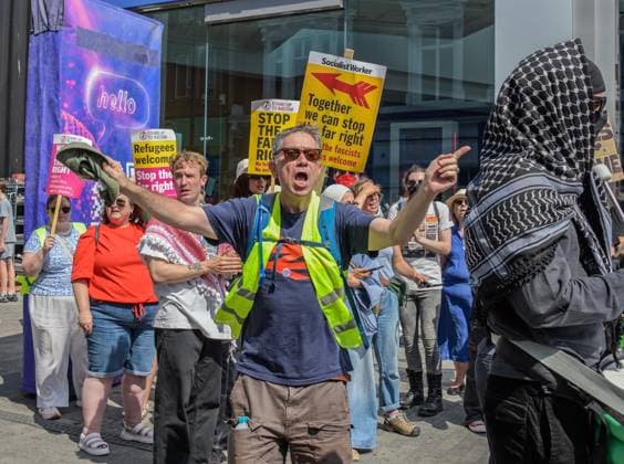 Anti-immigration demonstrators and Stand Up to Racism counter-protesters rally in Maidstone MAIDSTONE, UNITED KINGDOM - AUGUST 15: Activists from Stand Up to Racism assemble outside County Hall in Maidstone, Kent, United Kingdom, on August 15, 2026, to counter-protest against the far-right Kent Nationalist Movement as they gathered before marching through the town center. While the far-right group voiced opposition to government border policies, asylum seeker housing programs, and mass migration, Stand Up to Racism demonstrators chanted slogans and displayed placards to denounce far-right activity and express solidarity with refugees, with police officers maintaining a presence to keep the opposing groups separated. Stuart Brock Anadolu M Copyright: x2026xAnadoluxStuartxBrockx