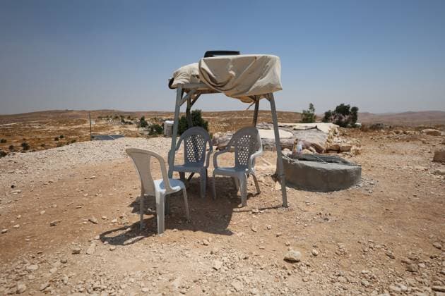 August 16, 2026, Masafer Yatta, Palestine, State of: MASAFER YATTA, WEST BANK, PALESTINE, AUGUST 16, 2026: Palestinian Abdullah Dababseh holds his phone displaying a demolition order issued by the Israeli army for the cave where he lives in Khirbet Khallet Al-Dabaa, south of Hebron. According to local residents, demolition orders were issued for three homes, three caves, a school, trees and crops in the area. Residents said the village was demolished in May 2025, forcing some Palestinians to live in caves. Masafer Yatta Palestine, State of - ZUMAq101 20260816_zna_q101_111 Copyright: xMosabxShawerx