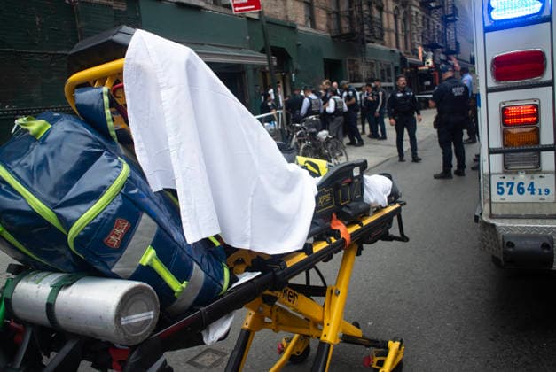 August 16, 2026, New York City, New York, USA: NYPD officers shot and killed a man they said was armed with a butcher s knife inside an apartment building on the Lower East Side Sunday, August 16th, 2026 afternoon. Officers were called out to the building for reports of an assault. When they got there, they said they found a blood trail on the stairs. Officers followed the blood trail, and found a man, identified as 54-year-old Wei Chan, who they said was armed with a butcher s knife. According to the department, officers ordered Chan to show his hands multiple times, and he refused. That s when officers shot Chan. .Wei Chan was taken to a nearby hospital where he was later pronounced dead. The shooting happened around 4 p.m. at a building - ZUMAt442 20260816_znp_t442_003 Copyright: xBillyxTompkinsx