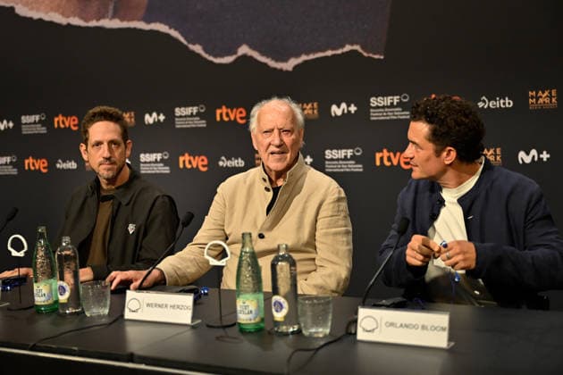 Werner Herzog Receives the Donostia Award at the San Sebastián Film Festival Director, screenwriter, producer, and actor Werner Herzog (c), accompanied by producer Ariel Leon Isacovitch (I) and actor Orlando Bloom (d), speaks with the media before receiving the Donostia Award, at the Kursaal on September 18, 2026, in San Sebastián, Guipúzcoa, Basque Country, Spain. Director, screenwriter, producer, and actor Werner Herzog will receive the Donostia Award in recognition of his career during the opening gala of the San Sebastián Film Festival, which will take place September 18–26 for its 74th edition. The Festival’s highest honorary distinction for the German filmmaker will be accompanied by a screening of his new feature film, ‘Bucking Fast Copyright: xArnaitzxRubiox 7783870