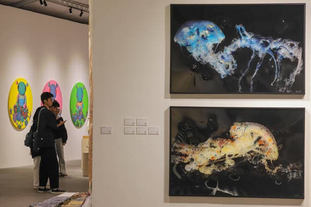 September 20, 2026, Surabaya, East Java, Indonesia: Visitors observe contemporary artworks at the ArtSubs 2026 exhibition at Balai Pemuda, Surabaya, East Java, Indonesia, on September 20, 2026. Titled border, threshold, beyond, the art exhibition features 500 works by 113 artists from across Indonesia, serving as a response to the public s need for a space of contemplation, reflection, and entertainment. Surabaya Indonesia - ZUMAp290 20260920_zip_p290_012 Copyright: xRendyxAgungxPrakosox