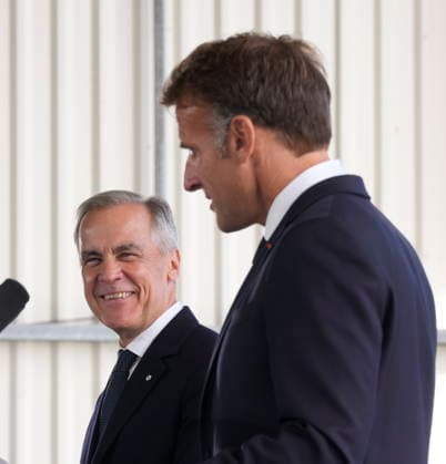 September 20, 2026, Saint-Pierre, France: Prime Minister Mark Carney, left, reacts to French President Emmanuel Macron as he delivers remarks in Saint-Pierre, Saint-Pierre-et-Miquelon, a French territory 20 kilometres off the southern coast of Newfoundland, on Sunday, Sept.20, 2026. Saint-Pierre France - ZUMAc35_ 20260920_zaf_c35_076 Copyright: xAdrianxWyldx