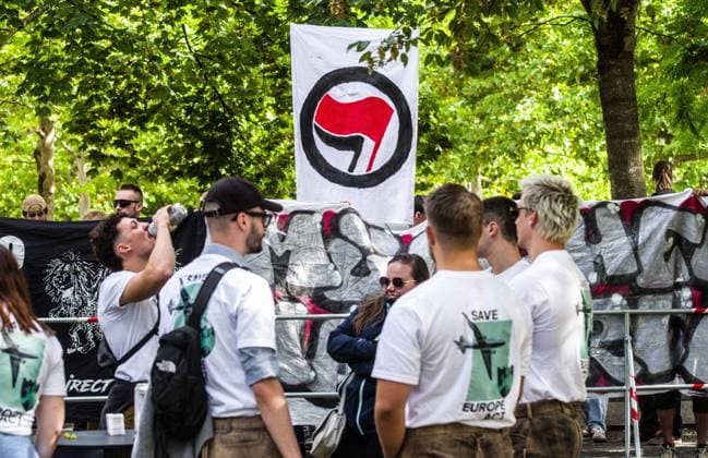 September 20, 2026, Munich, Bavaria, Germany: Coinciding with Oktoberfest, a group of right-extremists from the Identitaere Bewegung held a rally under the Banner of the Save Europe Act which includes, according to them, guidelines for the so-called Remigration. Some members discussed Remigration to include non-native born Germans, as they feel they can never be German, even if they hit all integration points. Critics in Germany see it as eyebrow-raising that the Identitaere leader, Martin Sellner, is an Austrian that is essentially making German policy and can play a greater role in government should the AfD take power. Munich Germany - ZUMAb160 20260920_abp_b160_025 Copyright: xSachellexBabbarx