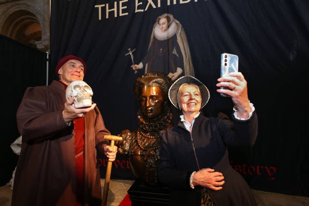 Old Scarlett, the Gravedigger, (David Scammell), and Costume maker and guide Kate Brown, take a selfie with a bust of Mary, Queen of Scots at the Mary Queen of Scots Exhibition in Peterborough Cathedral. The exhibition tells the story of one of Britain™s most fascinating monarchs and her remarkable connection to Peterborough using Mary s authentic belongings, letters, and reconstructed scenes from her life. Following her execution at nearby Fotheringhay in 1587, Mary was originally laid to rest at Peterborough Cathedral before her remains were later moved to Westminster Abbey. Mary, Queen of Scots Exhibition, Peterborough Cathedral, Peterborough, on 21st September, 2026. .