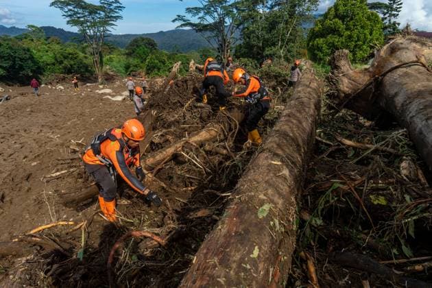 September 23, 2026, Solok Regency, Indonesia: SOLOK, WEST SUMATRA, INDONESIA, SEPTEMBER 23, 2026: Members of a joint search and rescue team comb an area affected by flash flooding in Arosuka, Solok, West Sumatra, as operations continue to locate a missing resident. Search teams from Indonesiaâ€⠢s National Search and Rescue Agency (BASARNAS), working alongside local residents, are searching for 59-year-old Agusral, who was reported missing after being swept away by floodwaters on September 21. Search efforts focused on several locations along the path of flood debris and a nearby river. Solok Regency Indonesia - ZUMAq101 20260923_zna_q101_022 Copyright: xWawanxKurniawanx
