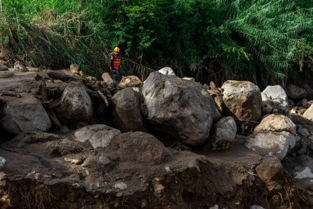 September 23, 2026, Solok Regency, Indonesia: SOLOK, WEST SUMATRA, INDONESIA, SEPTEMBER 23, 2026: Members of a joint search and rescue team comb an area affected by flash flooding in Arosuka, Solok, West Sumatra, as operations continue to locate a missing resident. Search teams from Indonesiaâ€⠢s National Search and Rescue Agency (BASARNAS), working alongside local residents, are searching for 59-year-old Agusral, who was reported missing after being swept away by floodwaters on September 21. Search efforts focused on several locations along the path of flood debris and a nearby river. Solok Regency Indonesia - ZUMAq101 20260923_zna_q101_029 Copyright: xWawanxKurniawanx