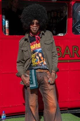 September 26, 2026, London, United Kingdom: An attendee at the King™s Cross Classic Car Boot Sale in London poses for photographs. The Kings Cross Classic Car Boot Sale returned to Granary Square and Stable Street, King™s Cross, London, for its 11th year. Held several times throughout the year, the event brings together vintage fashion, second-hand clothing, jewellery, homewares, collectables and vinyl records alongside classic cars, motorcycles and commercial vehicles. Visitors browsed stalls and traders, with many making a special effort to dress in period clothing inspired by the 1950s, 1960s and 1970s.continuing a tradition associated with the event. London United Kingdom - ZUMAs197 20260926_aaa_s197_375 Copyright: xJamesxWilloughbyx