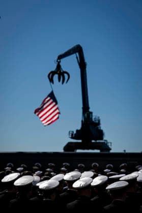 Members of the Navy listen during an event at Tradepoint Atlantic in Sparrows Point, Maryland on Tuesday, Oct. 6, 2026. Anduril is in advanced talks to build an autonomous surface-vessel factory at Tradepoint Atlantic, which would give the company an East Coast hub alongside its Foss Maritime shipyard in Seattle and undersea-vehicle factory at Quonset Business Park in Rhode Island. BAL20261006103 AlxDrago
