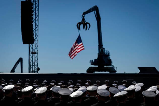 Members of the Navy listen during an event at Tradepoint Atlantic in Sparrows Point, Maryland on Tuesday, Oct. 6, 2026. Anduril is in advanced talks to build an autonomous surface-vessel factory at Tradepoint Atlantic, which would give the company an East Coast hub alongside its Foss Maritime shipyard in Seattle and undersea-vehicle factory at Quonset Business Park in Rhode Island. BAL20261006105 AlxDrago