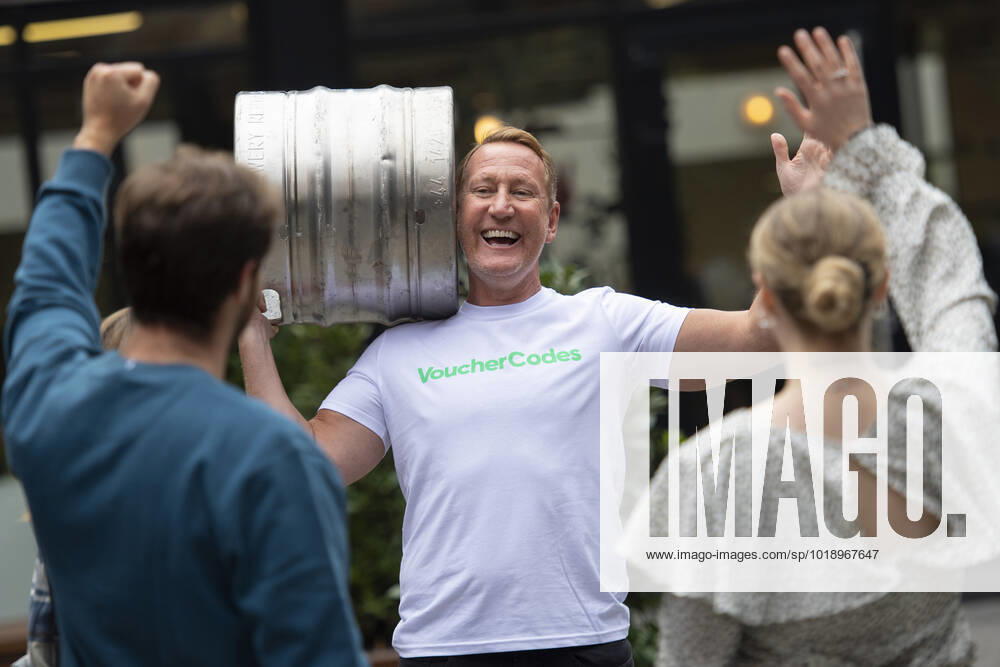 London, United Kingdom. Former England midfielder, Ray Parlour, launches the VoucherCodes On Tap service, delivering beer to fans at their place of work, so they can sip on a beer as they enjoy Englands opening fixture against Iran.