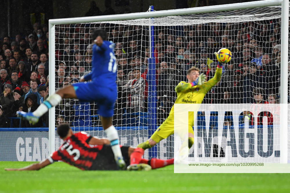 Chelsea v Bournemouth Premier League 27 12 2022. AFC Bournemouth goalkeeper Mark Travers (1) makes a save from Chelsea forward Raheem Sterling (17) during the Premier League match between Chelsea and Bournemouth at Stamford Bridge, London, England on 27 December 2022. London Stamford Bridge Greater London England Editorial use only DataCo restrictions apply See www.football-dataco.com ,