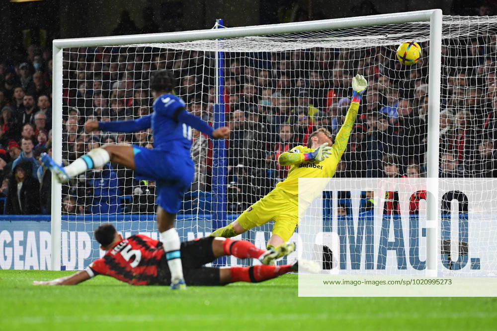 Chelsea v Bournemouth Premier League 27 12 2022. AFC Bournemouth goalkeeper Mark Travers (1) makes a save from Chelsea forward Raheem Sterling (17) during the Premier League match between Chelsea and Bournemouth at Stamford Bridge, London, England on 27 December 2022. London Stamford Bridge Greater London England Editorial use only DataCo restrictions apply See www.football-dataco.com ,