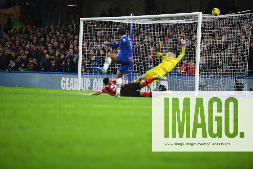 Chelsea v Bournemouth Premier League 27 12 2022. AFC Bournemouth goalkeeper Mark Travers (1) makes a save from Chelsea forward Raheem Sterling (17) during the Premier League match between Chelsea and Bournemouth at Stamford Bridge, London, England on 27 December 2022. London Stamford Bridge Greater London England Editorial use only DataCo restrictions apply See www.football-dataco.com ,