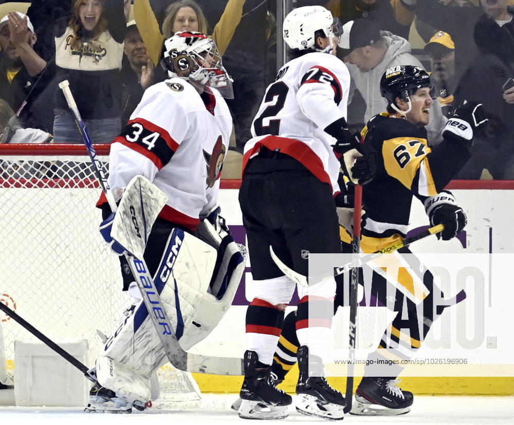 Pittsburgh Penguins right wing Rickard Rakell (67) skates pass Ottawa Senators goaltender Dylan Ferguson (34) as he celebrates his third period goal at PPG Paints Arena in Pittsburgh on Monday, March 20, 2023. PIT2023032016 ARCHIExCARPENTER