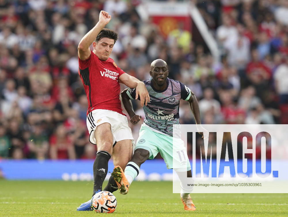 Manchester, England, 7th October 2023. Harry Maguire of Manchester United, ManU tackles Yoane Wissa of Brentford during the Premier League match at Old Trafford, Manchester. Picture credit should read: Andrew Yates Sportimage . SPI-2635-0029