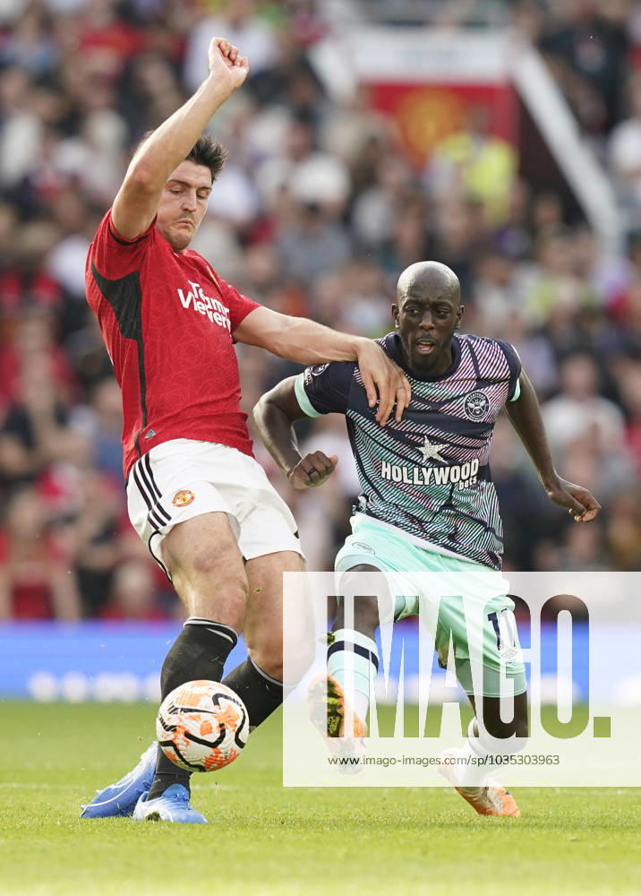 Manchester, England, 7th October 2023. Harry Maguire of Manchester United, ManU tackles Yoane Wissa of Brentford during the Premier League match at Old Trafford, Manchester. Picture credit should read: Andrew Yates Sportimage . SPI-2635-0030