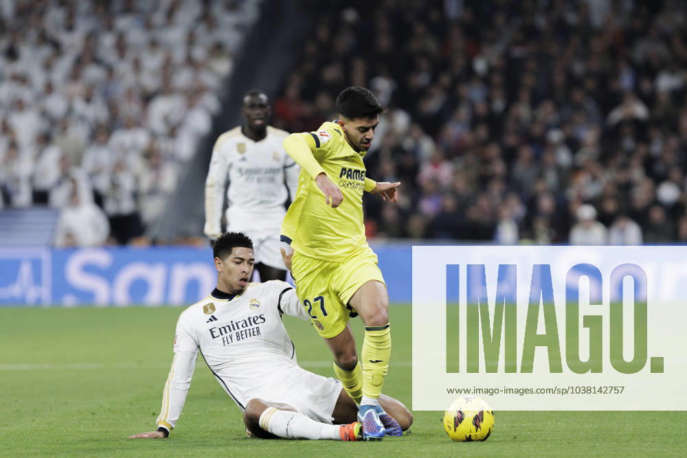 LA LIGA EA Sports - Real Madrid vs Villarreal Jude Bellingham of Real Madrid and Ilias Akhomach of Villarreal are playing during the La Liga 2023 24 match between Real Madrid and Villarreal at Santiago Bernabeu Stadium in Madrid, Spain, on December 17, 2023. Madrid Spain