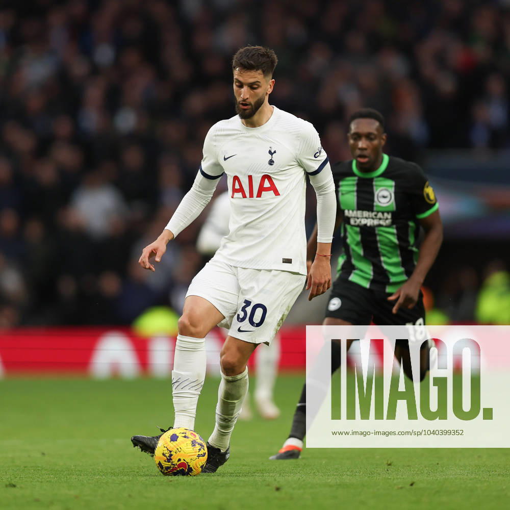 Rodrigo Bentancur of Tottenham Hotspur is challenged by Danny Welbeck of Brighton & Hove Albion during the Premier League match between Tottenham Hotspur and Brighton and Hove Albion at Tottenham Hotspur Stadium, London, England on 10 February 2024.